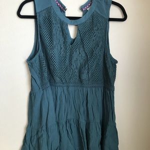 Sleeveless tunic blouse with embroidered top